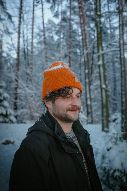 istock Winter holidays in the snow. Man walking through a snow covered forest 2133079626