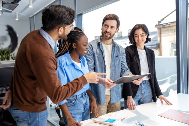 istock Diverse colleagues cooperating together at office 2133105401
