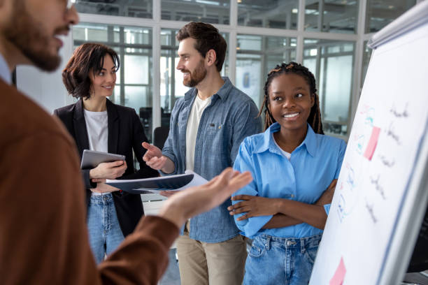 istock Group of employees training in boardroom with whiteboard and project information 2133105515