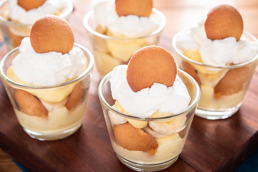 Banana pudding trifle with vanilla wafers in a large digh glass