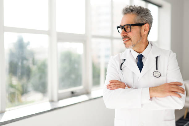 istock Experienced confident senior doctor with grey hair 2133153138