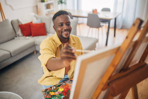 istock Smiling artist painting at home 2133156841
