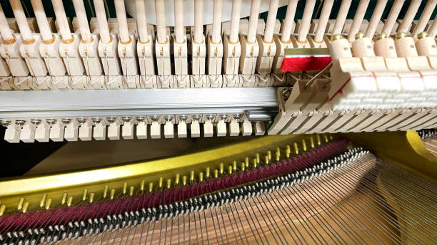 istock close-up broken piano, wooden hammer working and moving inside instrument 2133158931