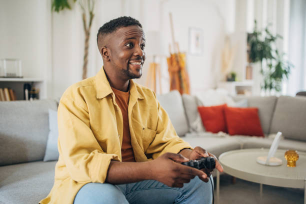 istock Leisure time: joyful man gaming at home 2133161090