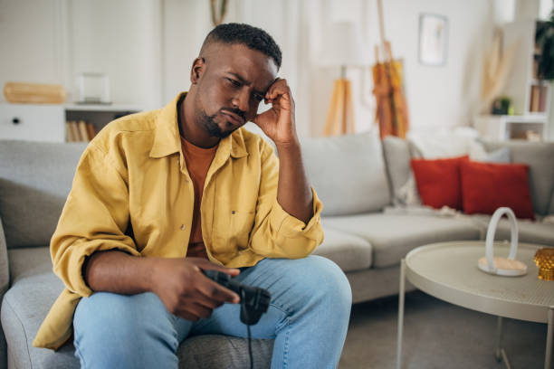 istock Thoughtful man contemplating at home 2133170978