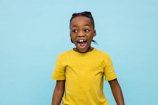 istock African american cute boy looking excited and contented 2133190745