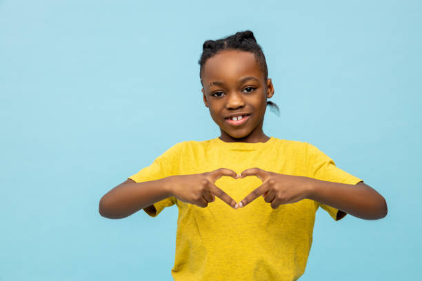 istock Boy in yellow tshirt gesticulating and smiling 2133191352