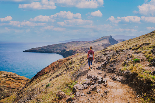 Woman hiking through Ponta de São Lourenço peninsula in Madeira Portugal