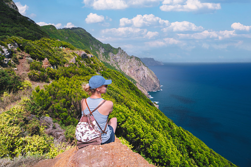 Woman enjoying the view of Madeira coastline Portugal