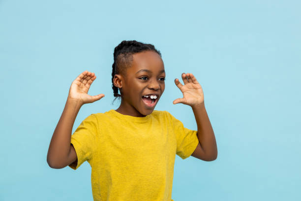 istock African american cute boy looking excited and contented 2133191901