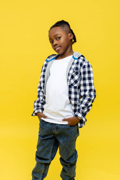 istock Dark-skinned boy in checkered shirt looking confident 2133191905