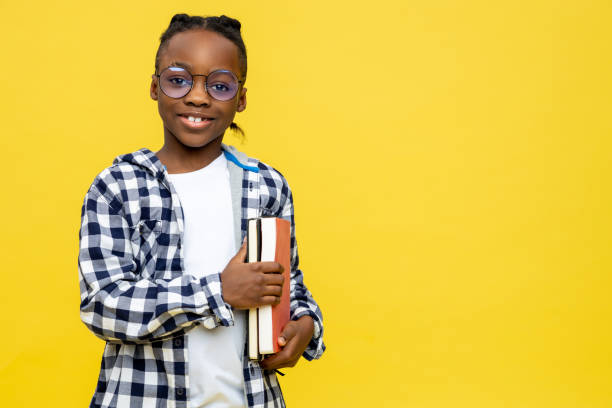istock African american schoolboy in checkered shirt ready for lessons 2133191911