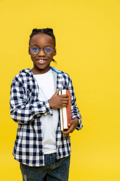 istock African american schoolboy in checkered shirt ready for lessons 2133191913