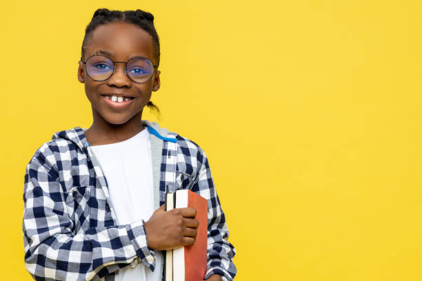 istock African american schoolboy in checkered shirt ready for lessons 2133191917