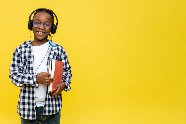 istock Cute dark-skinned boy with books in hands feeling positive 2133191918