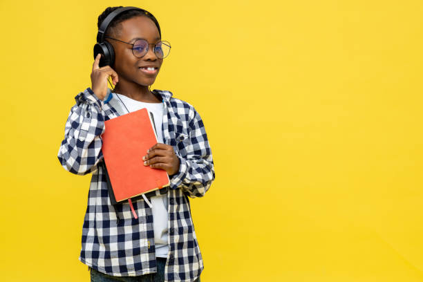 istock Cute dark-skinned boy with books in hands feeling positive 2133191924