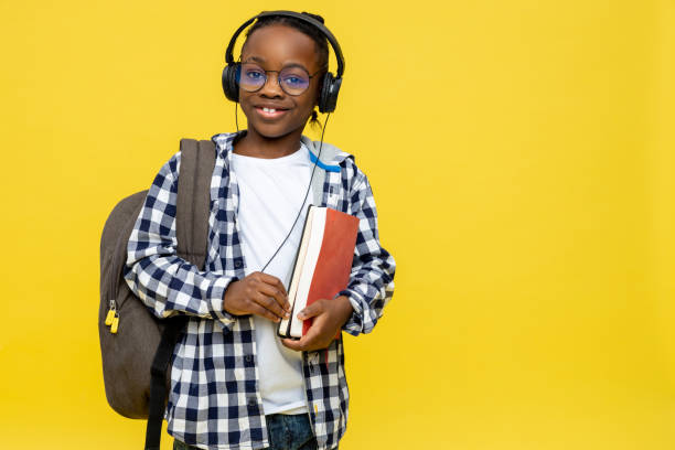 istock African american boy with backpack and book in hands 2133191926