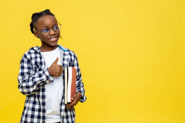 istock African american schoolboy in checkered shirt ready for lessons 2133191927