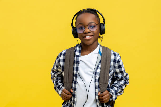 istock Cute african american schoolboy in checkered tshirt looking happy 2133191932