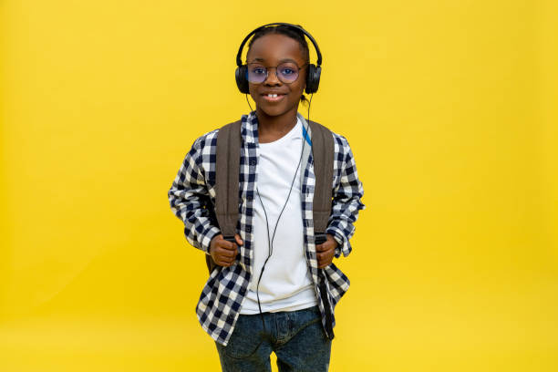 istock Cute african american schoolboy in checkered tshirt looking happy 2133191945