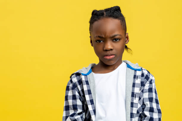 istock Boy in checkered shirt looking moody and frowned 2133192449