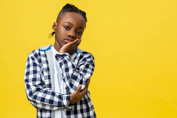 istock Kid in checkered shirt looking tired and sleepy 2133192459