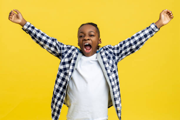 istock African american boy stretching and looking sleepy 2133192461