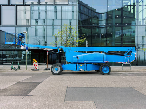 istock aerial work platform parked folded on the side of the road 2133197185
