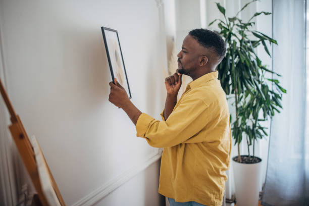 istock Man contemplating artwork at home 2133222847