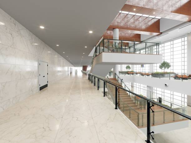 istock modern office building interior with stairs and plants. 2133223893
