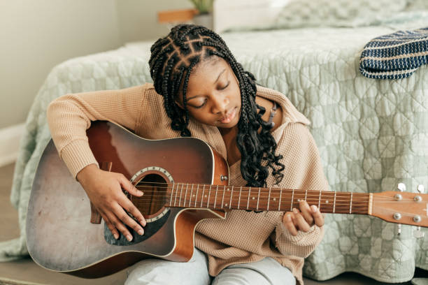 Melodic Moments: Teen Transforms Home into a Haven of Guitar Riffs