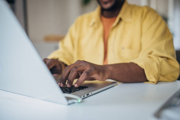 istock African american man working on laptop at home 2133240481