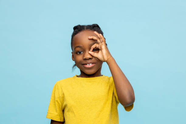 istock Smiling African American little boy showing okay gesture 2133250880