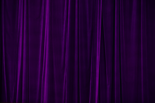 purple curtain in theatre. Textured background