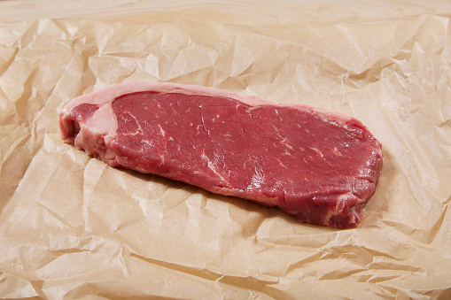 Seasoning Raw Venison Strip Steaks