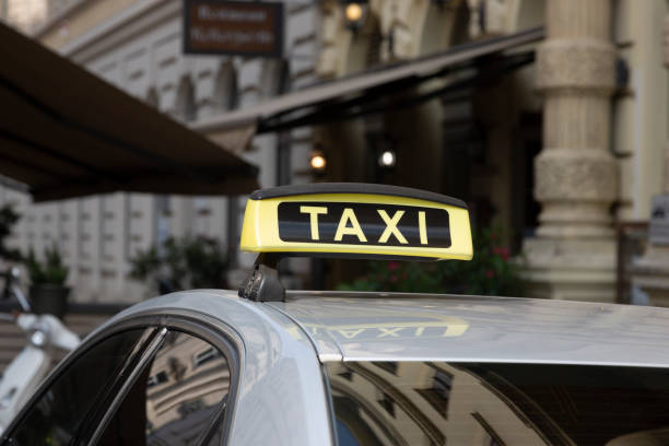 istock Checker taxi lighted rooftop car on a blurred background 2133321152