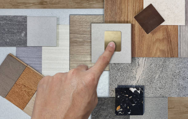 istock interior architect chooses material samples including granite tiles, terrazzo, wooden vinyl flooring tiles, stainless, quartz, wallpaper, wooden engineering floor tiles palette, close up view. 2133333816