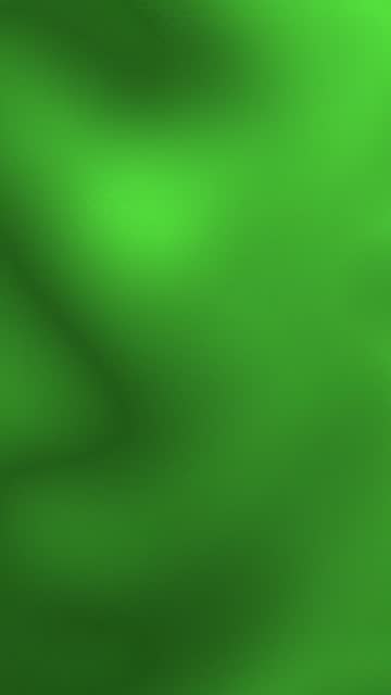 Vertical video of green colors with gradient and blurred background.