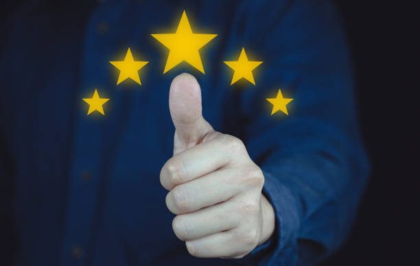 istock Customer review good rating concept hand pressing five star on visual screen and positive customer feedback testimonial. 2133366759