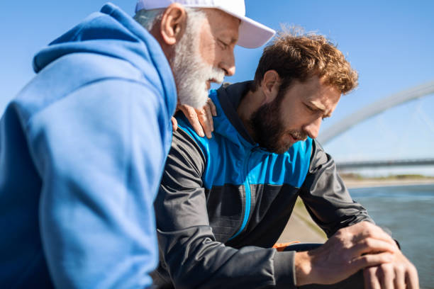 istock Father and Son Enjoying Break by the River 2133372537