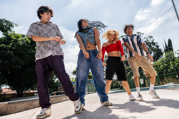 Young friends dancing outdoors