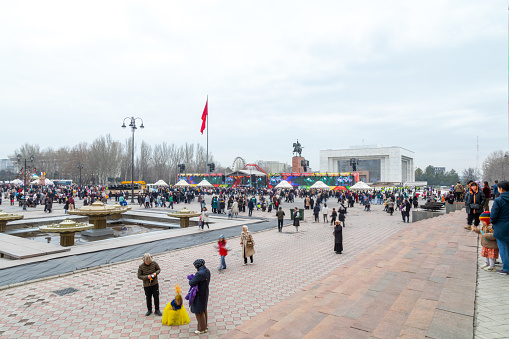 Bishkek, Kyrgyzstan - March 21, 2024: People celebrating Nowruz on central square of Bishkek city. Nowrus is a holiday of the arrival of spring and the New Year according to the astronomical solar calendar