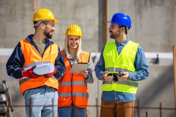 istock Construction team planning a building blueprint project on site with collaboration for architect innovation. 2133422777