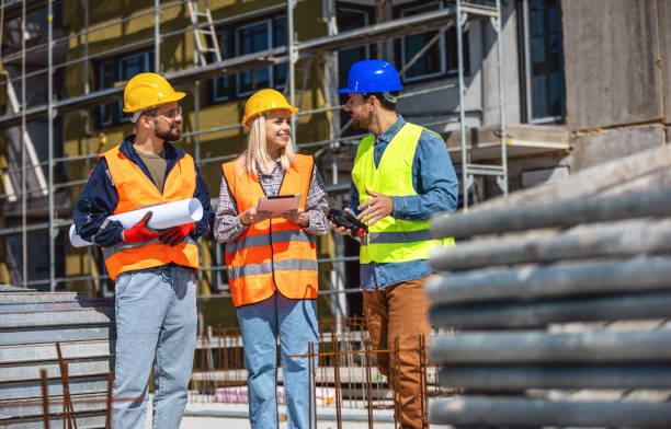 istock Construction team planning a building blueprint project on site with collaboration for architect innovation. 2133422778