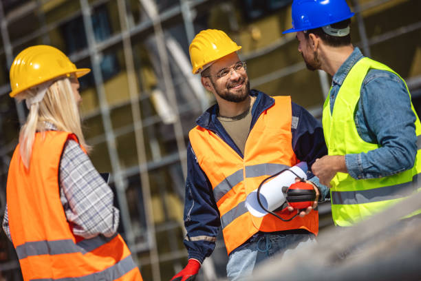 istock Construction team planning a building blueprint project on site with collaboration for architect innovation. 2133424353