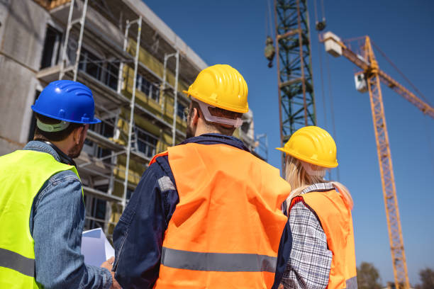 istock Construction team planning a building blueprint project on site with collaboration for architect innovation. 2133426439