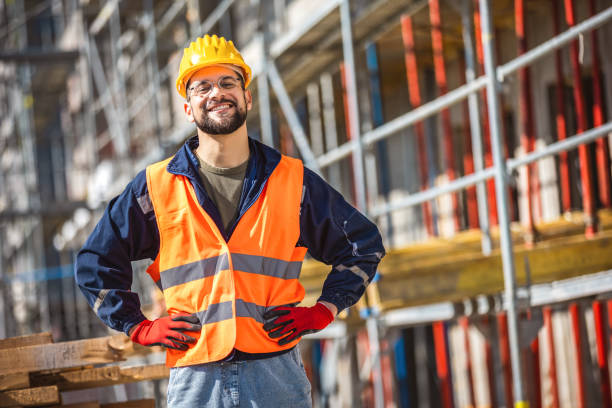 istock Construction site manager standing  wearing safety vest and helmet, thinking at construction site. 2133430103