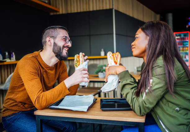 istock Couple eating in fast food restaurant 2133437300