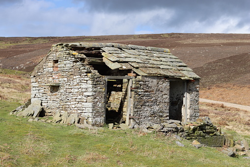 Abandoned stone outbuilding in remote moorland