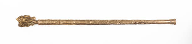 elegant golden walking cane isolated on white background